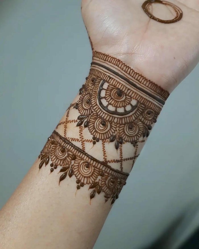 Wrist Mehndi Design with delicate floral bracelet style