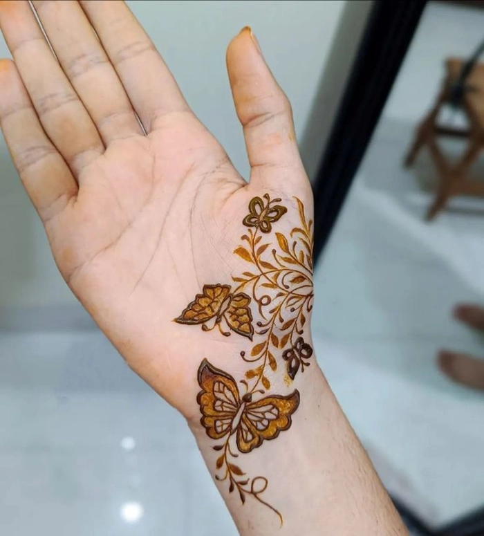 stylish mehndi wrist butterfly mehndi design