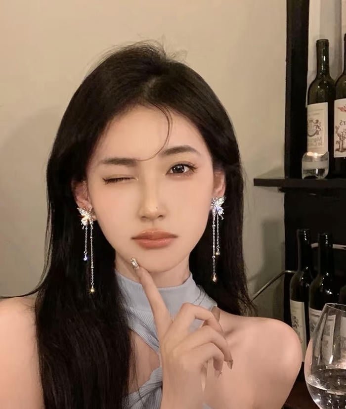 graceful earrings on female portrait