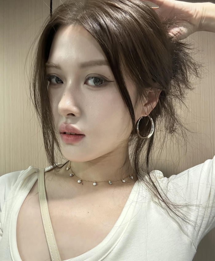 profile shot with bright earrings