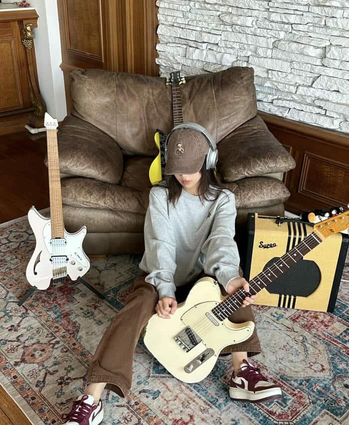 soft feminine look in guitar girl dp