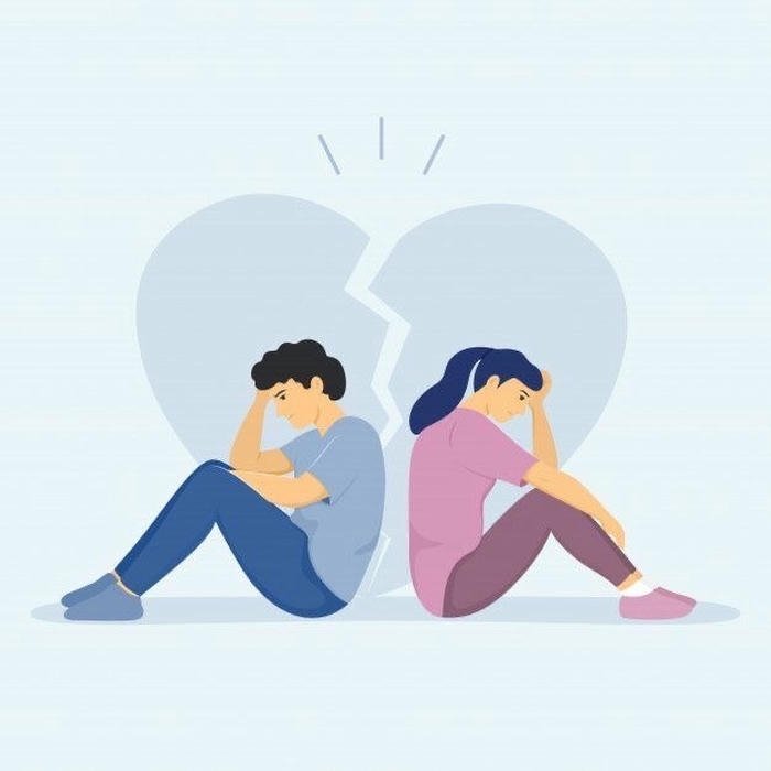 Crying couple sitting apart broken heart blue background.