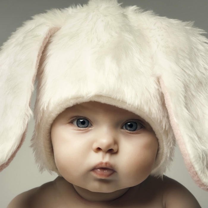 Cute baby bunny ears hat close up portrait