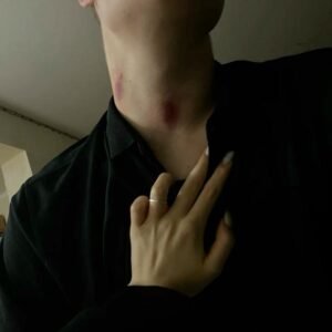 Hand on chest dark lighting neck mark skin view