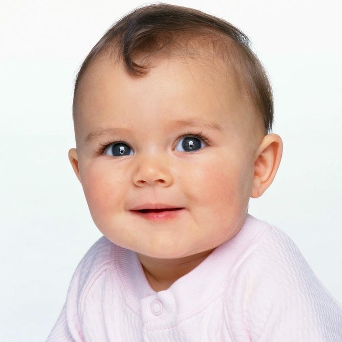 Happy baby boy blue shirt smiling white background