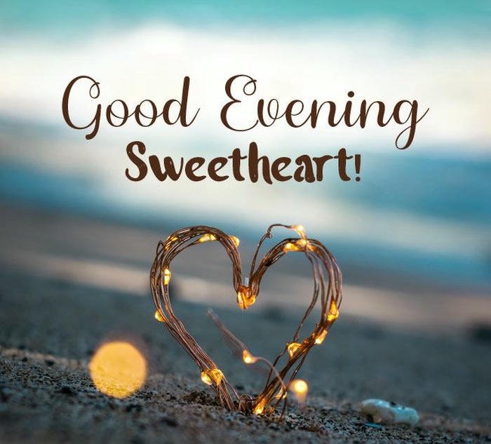 Heart shaped sparkler lights romantic evening sweetheart greeting text.
