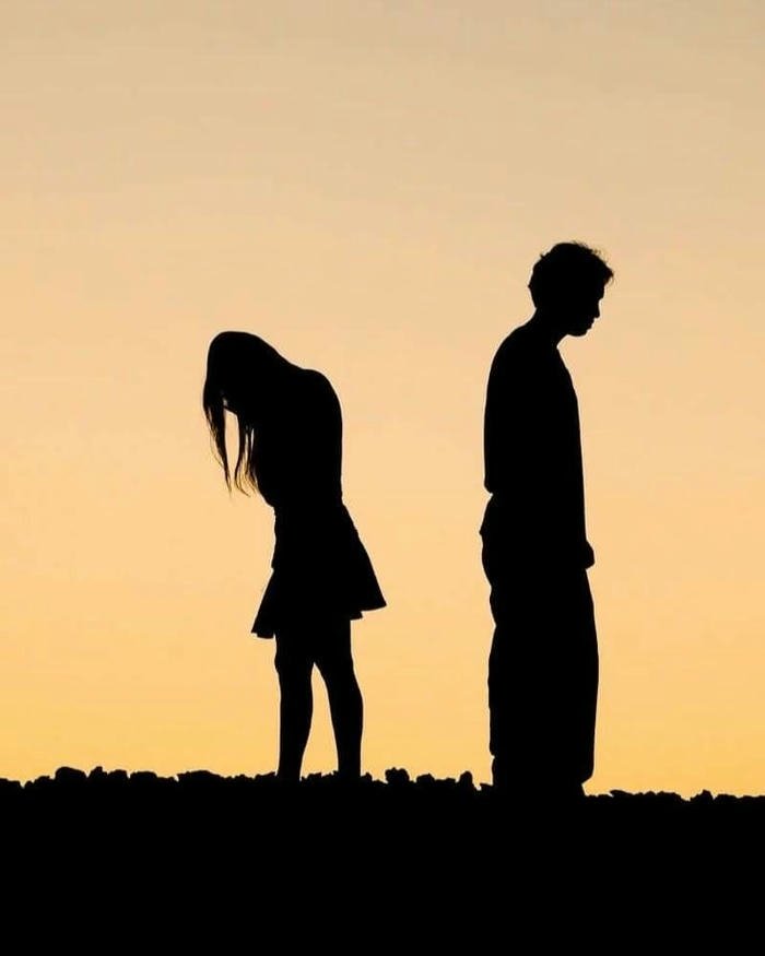 Love breakup images silhouette couple standing far apart sunset.