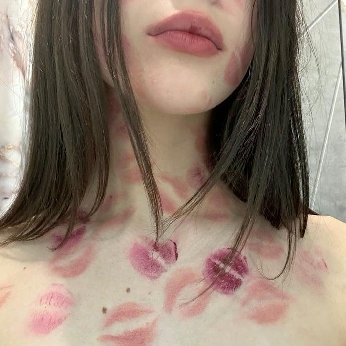 Red lipstick kisses woman chest neck pale skin art