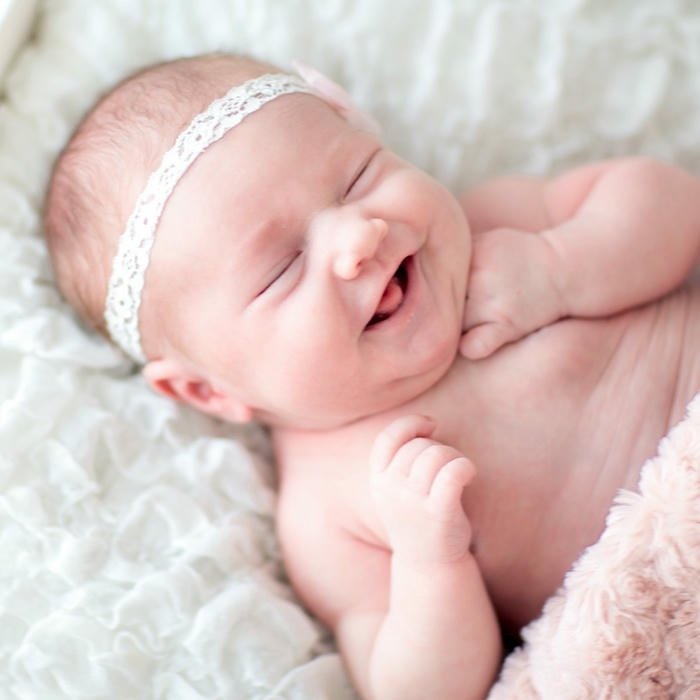 Sleeping baby white blanket peaceful dream soft light