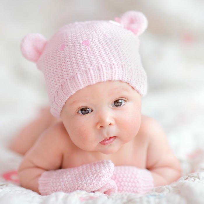 Sweet baby pink knit hat lying down soft