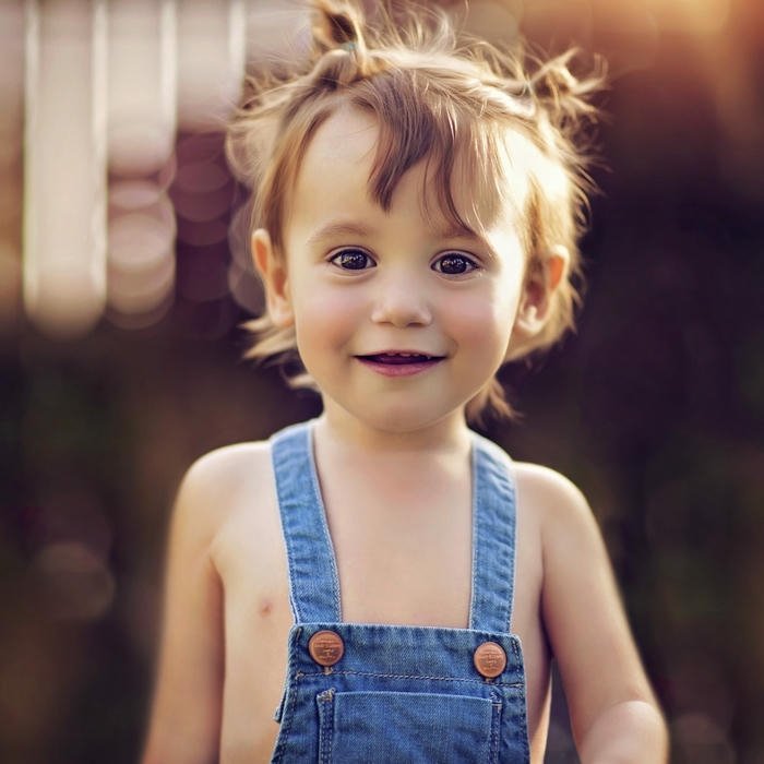 Toddler boy denim overalls smiling outdoor summer day