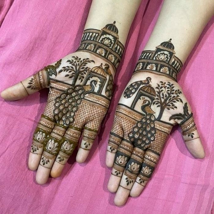 Detailed peacock themed henna design artistry