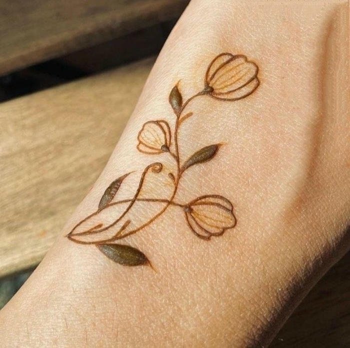 Elegant minimal henna artwork with delicate accents