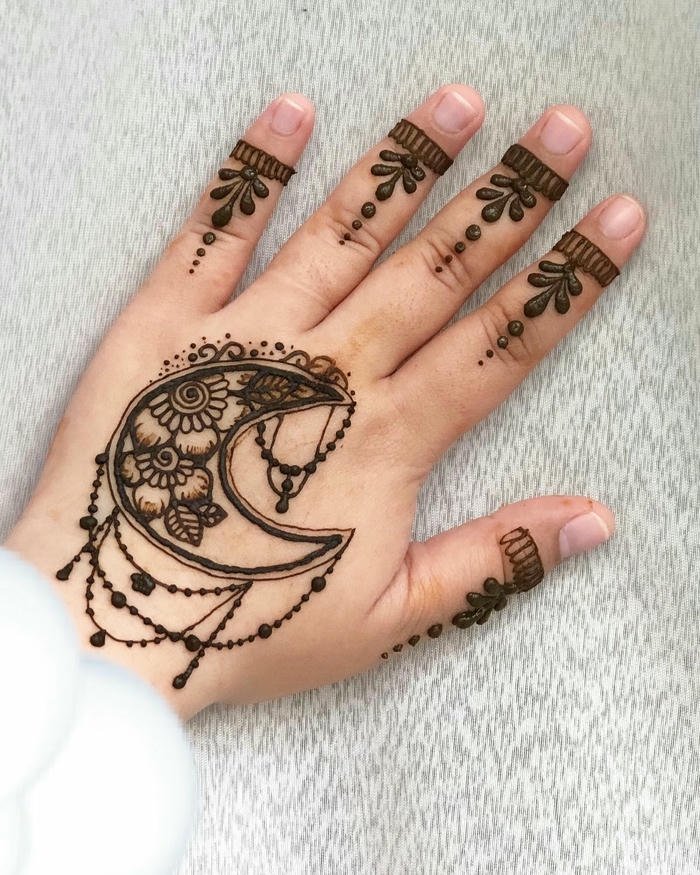 Mehndi moon design ornamental style emphasizing clarity elegance