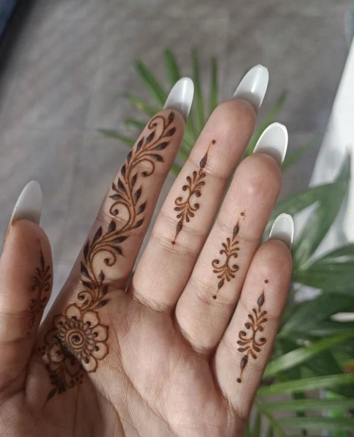 Minimal mehndi design styled with fine linear accents