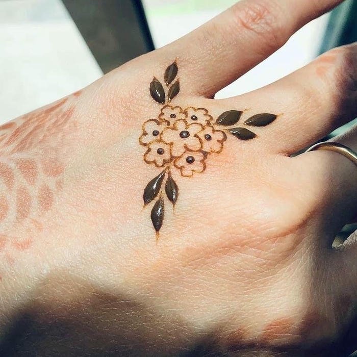 Minimal mehndi design with subtle elegant floral accents