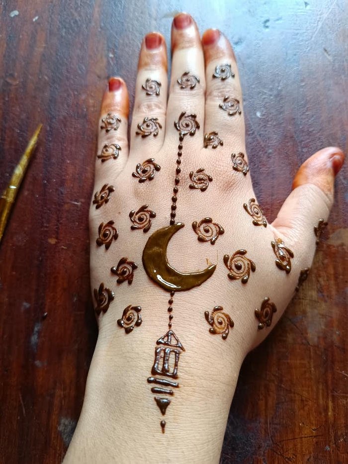 Moon inspired mehndi design subtle ornamental artistic shapes