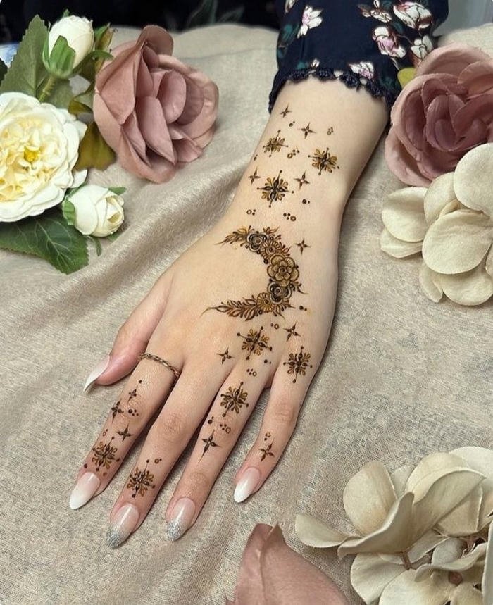 Moon mehndi design ornamental style emphasizing clarity and elegance