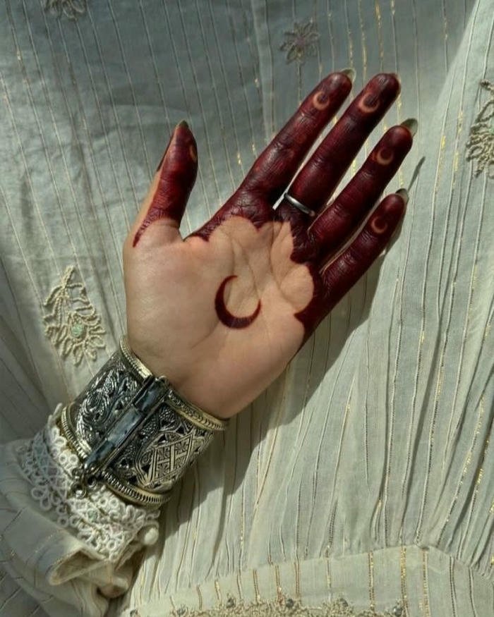 Moon mehndi design refined composition highlighting timeless beauty