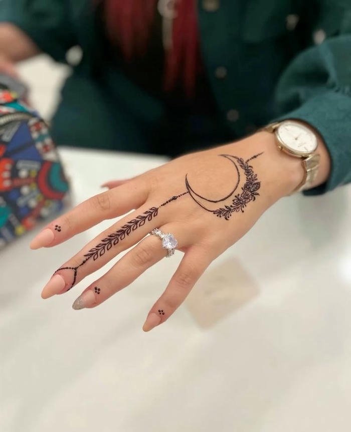 Moon themed mehndi design artistic patterns showing decorative features