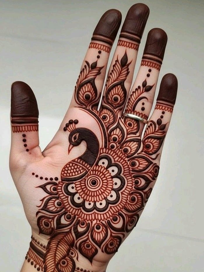 Peacock mehndi design displaying refined symmetrical artwork