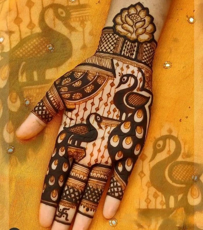 Peacock mehndi design emphasizing majestic feather shapes