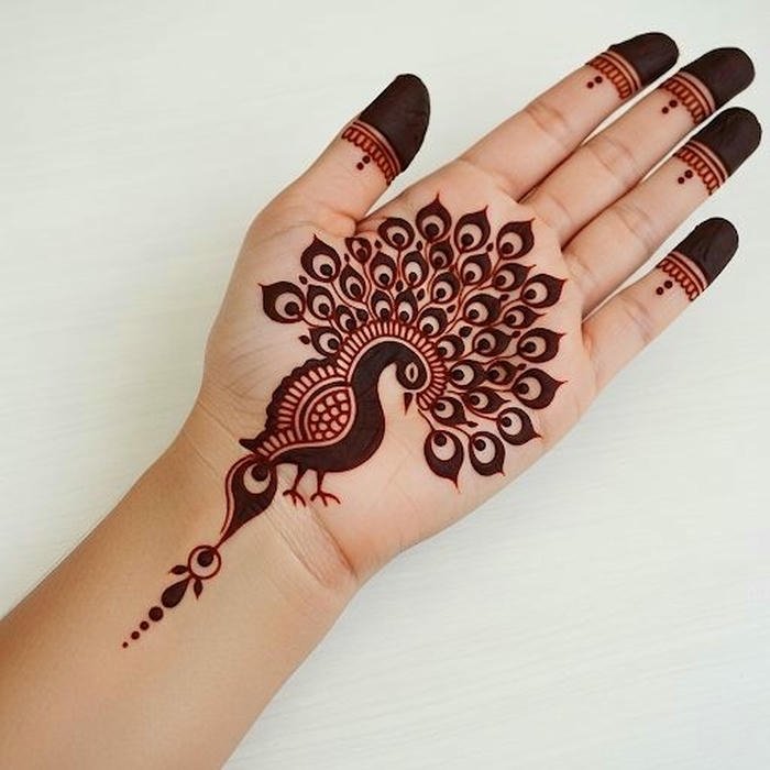 Peacock mehndi design enhanced by decorative flourishes