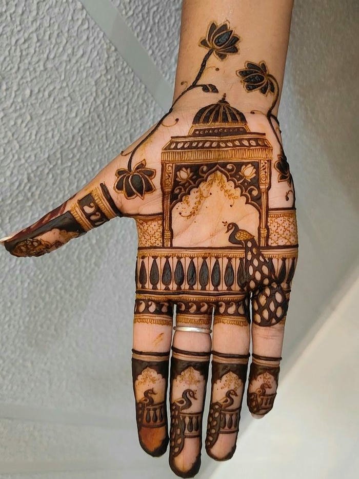 Peacock mehndi design featuring ornate detailing work