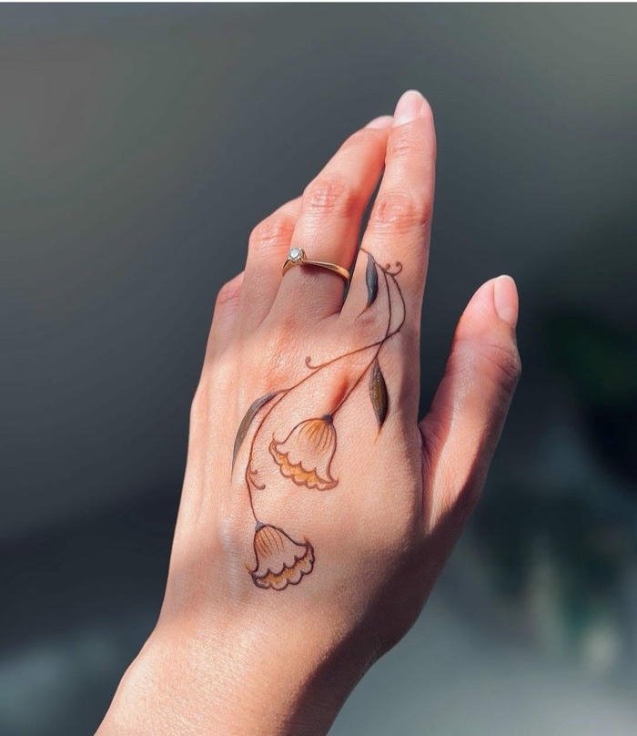 Sweet henna design showcasing intricate floral accents