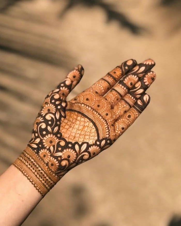 Teej mehndi design decorated with charming details