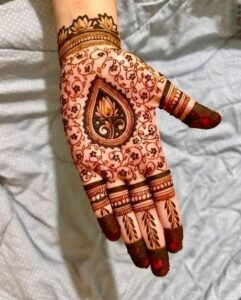 Teej mehndi design drawn with fine decorative strokes