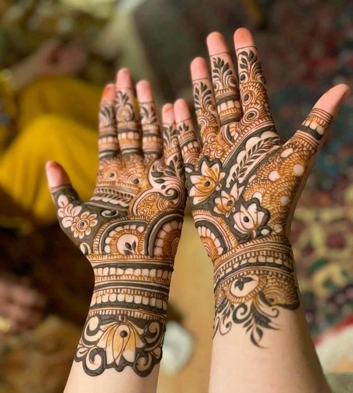 Teej mehndi design featuring intricate floral patterns