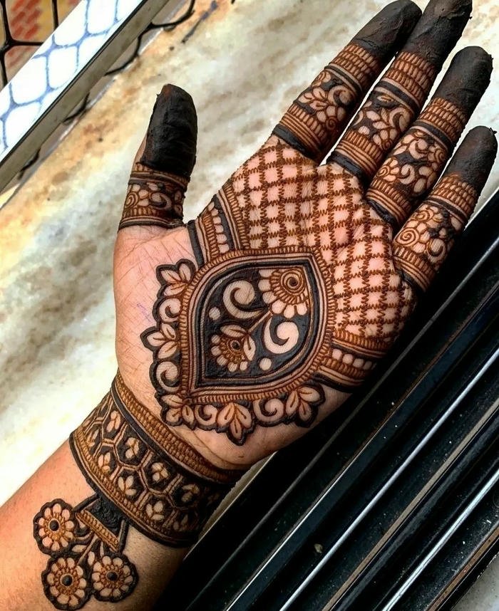 Teej mehndi design highlighting symmetrical creative motifs