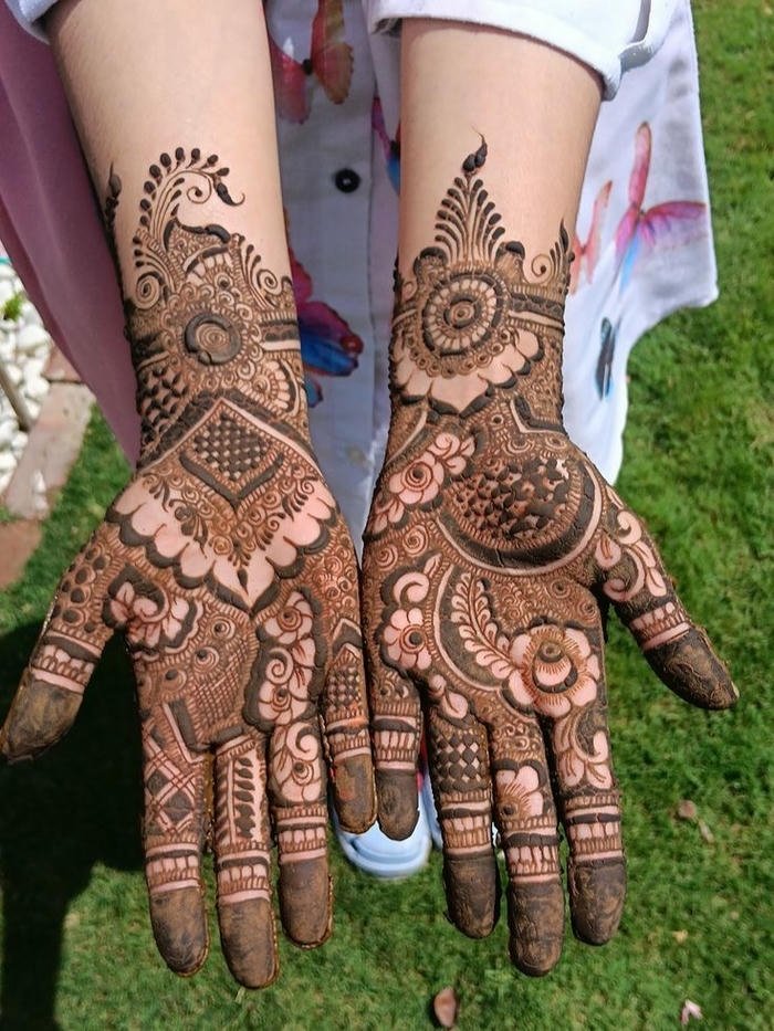 Teej mehndi design showcasing elaborate creative patterns
